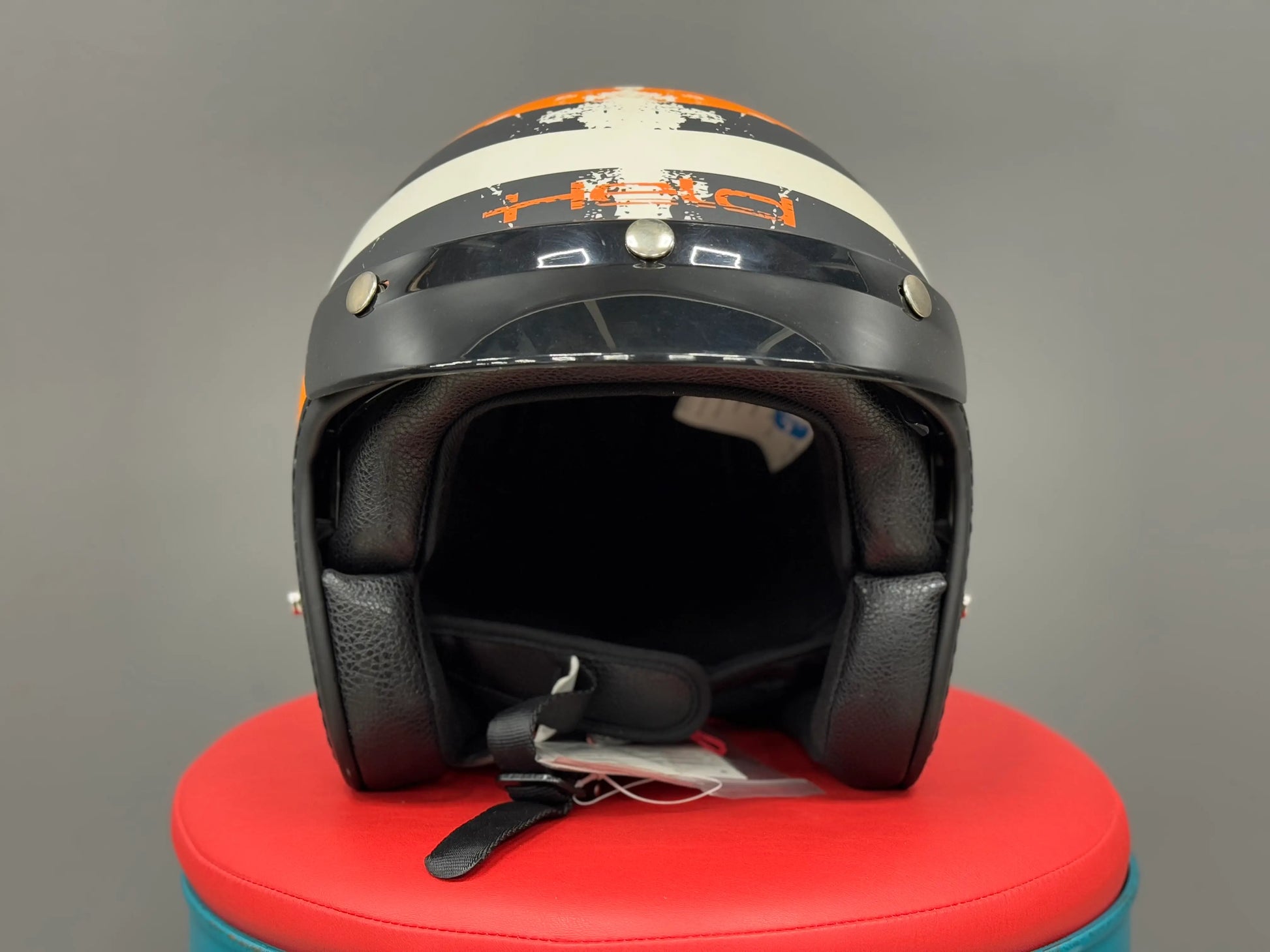 Held open-face helmet
